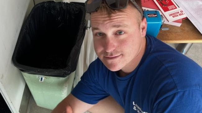 Wollongbar TAFE student Kye Myers posing in front of a bin his peers were forced to use as a toilet during the lockdown on November 23, 2023. Picture: Supplied