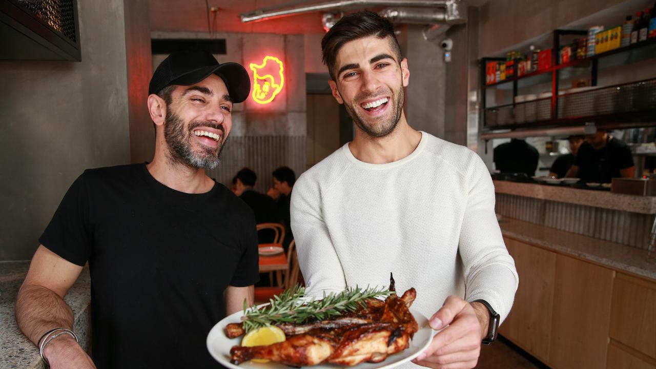Ibby Moubadder (right) at Henrietta Charcoal Chicken in Surry Hills. Picture: Justin Lloyd