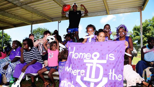 Tikilaru Dockers supporters pose for a photo at the Tiwi Grand Finals. Picture: Keri Megelus