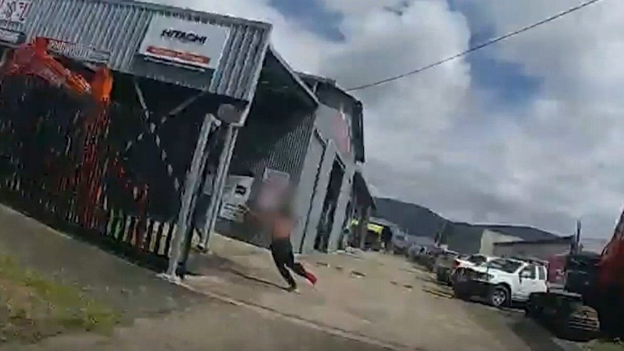 Police chase a kid who allegedly fled from a stolen car what crashed into a semi-trailer on Lyons St, Portsmith on Wednesday. Picture: Queensland Police