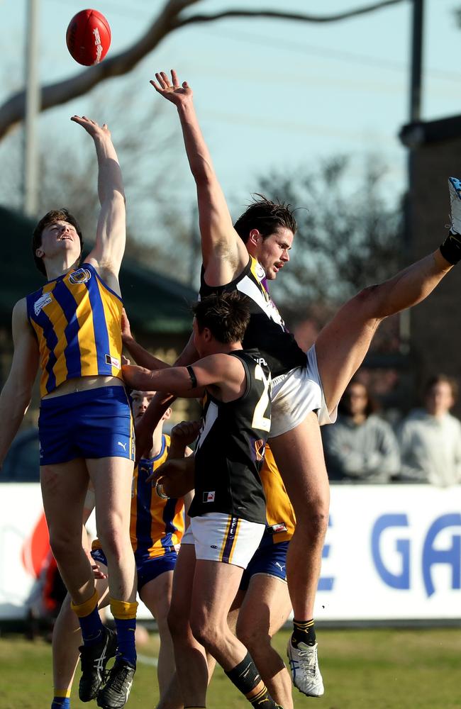 Norwood’s Tom Boyd and Noble’s Joel Cusack in a marking contest.