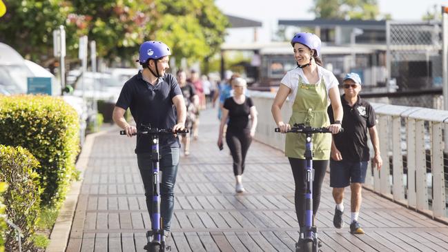 Hamish Mchardy and Kristina Sinnott riding around on the new e-scooters in Cairns. Picture: Supplied