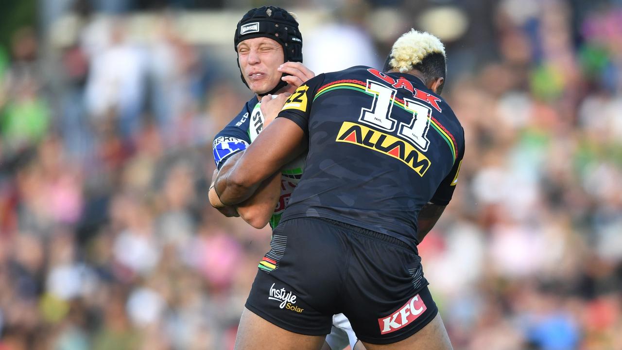 Viliame Kikau (11) lays a strong hit on Brad Schneider. Picture: NRL Photos