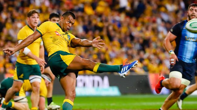 Australia's Kurtley Beale kicks the ball during the Rugby Championship match between Australia and Argentina at Suncorp Stadium in Brisbane on July 27, 2019. (Photo by Patrick HAMILTON / AFP) / -- IMAGE RESTRICTED TO EDITORIAL USE - STRICTLY NO COMMERCIAL USE --