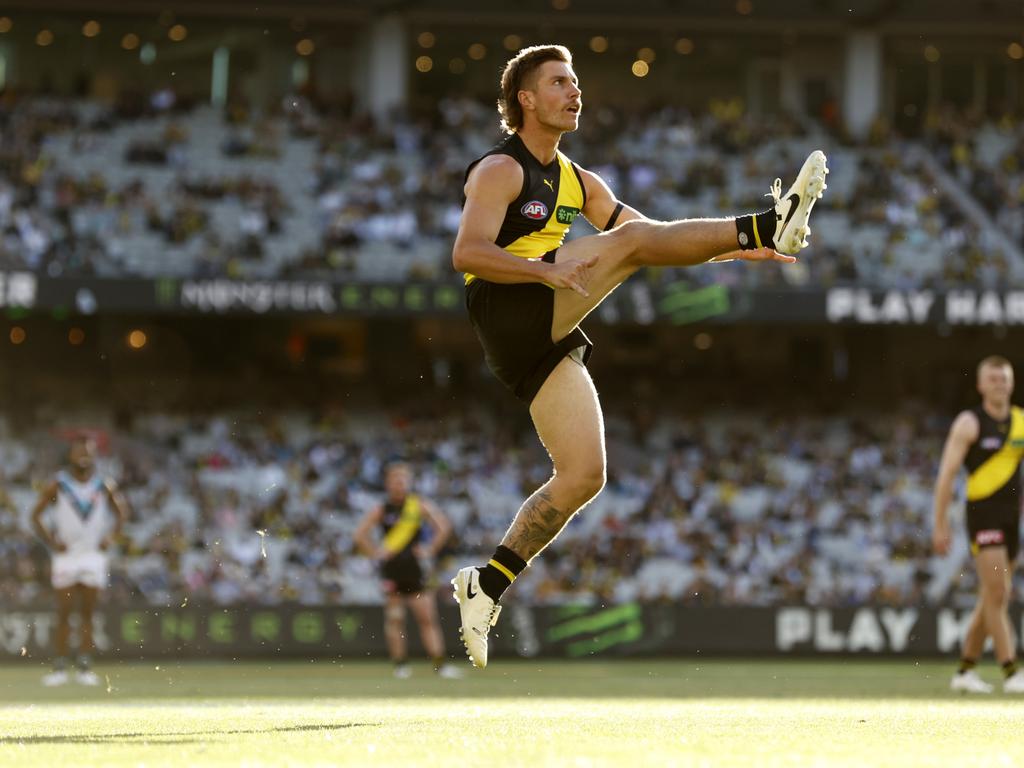 Liam Baker kicks a goal against Port Adelaide at the MCG during Round 2. Picture: Darrian Traynor/Getty Images.