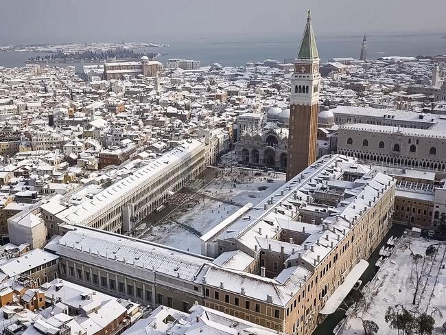 In this aerial image taken Wednesday, Feb. 28, 2018, Venice’s St. Mark’s Square, northern Italy, is covered by a blanket of snow as freezing weather from a Siberian cold snap persists in large part of the country. Picture: AP
