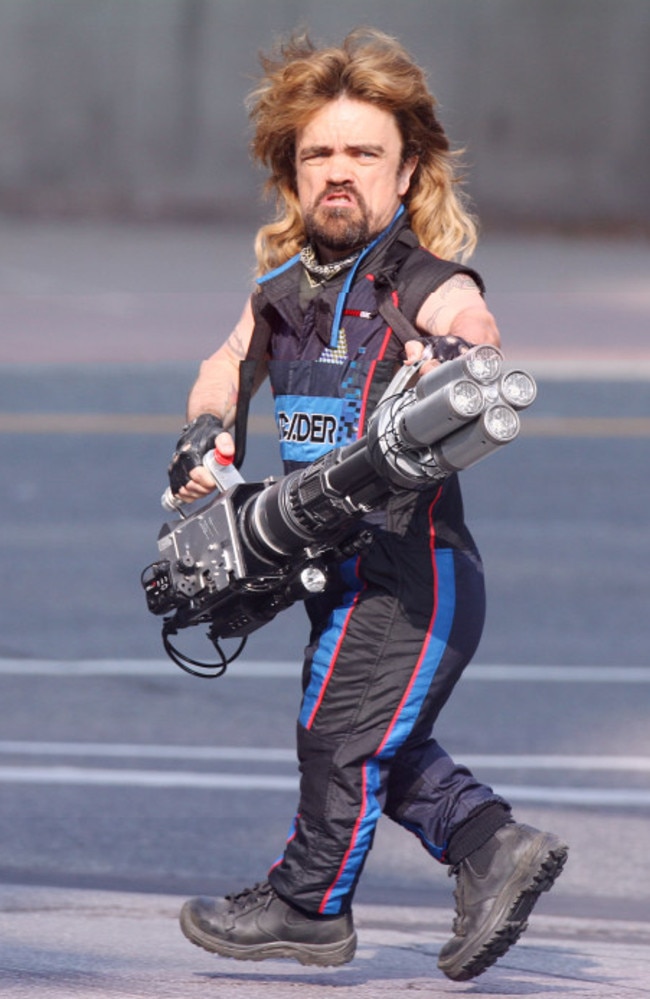 DINKLAGE POWER! The actor is seen holding what appears to be a huge bazooka while filming his new movie Pixels in Toronto. Picture: Pacific Coast News.