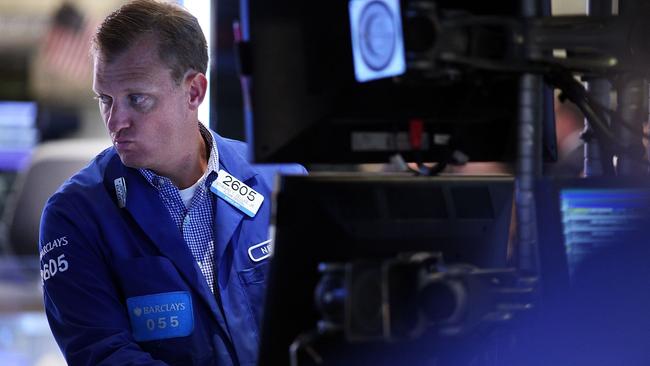 NEW YORK, NY - AUGUST 21: A trader works on the floor of the New York Stock Exchange (NYSE) on August 21, 2015 in New York City. The Dow fell over 500 points in trading today as global markets continue to react to economic events in China. Spencer Platt/Getty Images/AFP == FOR NEWSPAPERS, INTERNET, TELCOS & TELEVISION USE ONLY ==