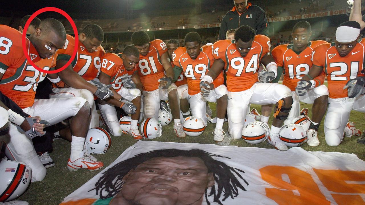 Teammates of Bryan Pata - including Rashaun Jones, circled - say a prayer over a mural of the dead college football player in 2006. Jones was arrested in connection with Pata’s killing this week. (Photo by Doug Benc/Getty Images)