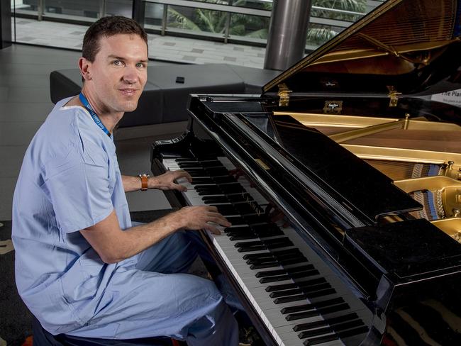 Cardiac Scientist Braden Dinham playing a  grand baby piano at the entrance of the Gold Coast University Hospital as part of the Creative Health Hub Gold Coast Health's Piano Project.   Picture: Jerad Williams