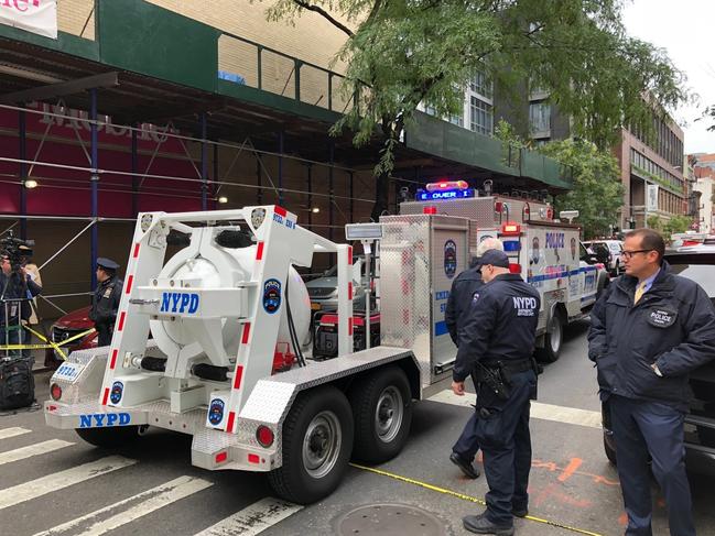 NYPD's Total Containment vessel arrives as law enforcement respond to the scene of a suspicious package at a postal facility, Friday, Oct. 26, 2018 in New York. Two law enforcement officials say a package closely resembling parcels sent to critics of President Donald Trump has been found at the postal facility in Manhattan.  The suspicious package was discovered by postal workers. (AP Photo/Mark Lennihan)