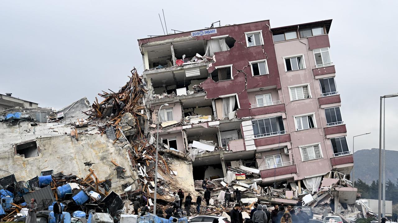 HATAY, TURKIYE - FEBRUARY 06: A view of a collapsed building in Hatay, Turkiye after 7.7 and 7.6 magnitude earthquakes hits Turkiye's Hatay, on February 06, 2023. Disaster and Emergency Management Authority (AFAD) of Turkiye said the 7.7 magnitude quake struck at 4.17 a.m. (0117GMT) and was centered in the Pazarcik district and 7.6 magnitude quake struck in Elbistan district in the province of Kahramanmaras in the south of Turkiye. Gaziantep, Sanliurfa, Diyarbakir, Adana, Adiyaman, Malatya, Osmaniye, Hatay, and Kilis provinces are heavily affected by the earthquakes. (Photo by Ercin Erturk/Anadolu Agency via Getty Images)