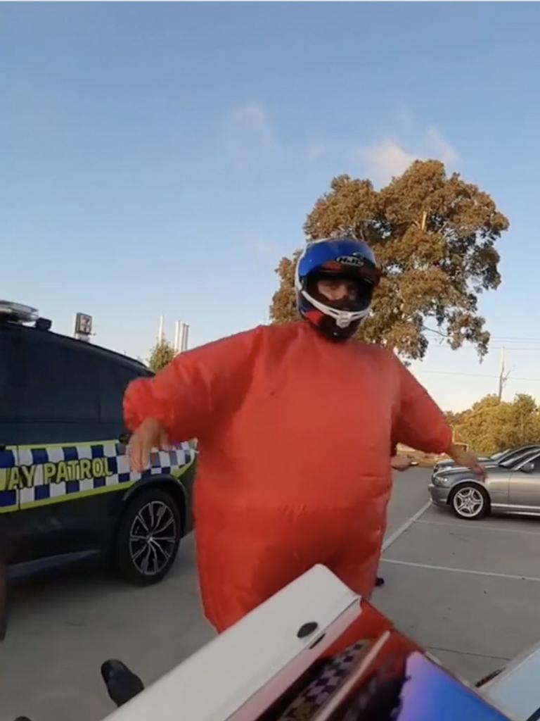 He was riding his motorcycle in a huge orange air suit. Picture: Instagram.