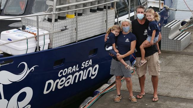 Great Barrier Reef tourism owner/operators Claire and Jan Zwick, pictured with their daughters Layla, 3, and Kaia, 5. Picture: Brendan Radke