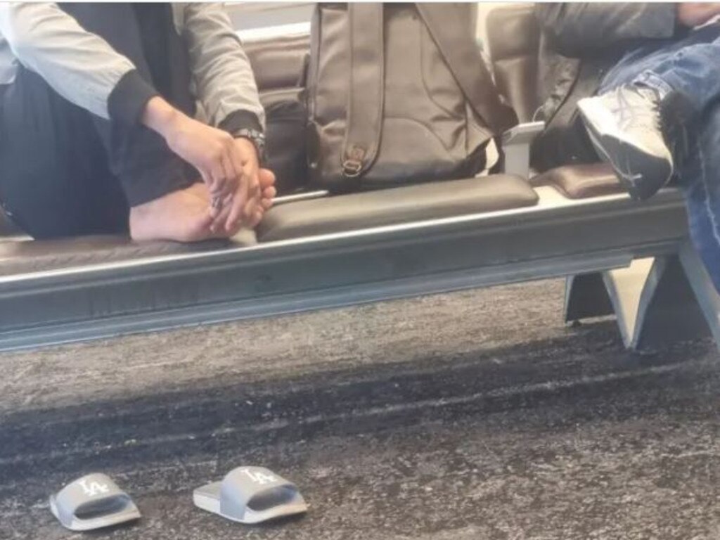 The passenger trims their nails in the boarding area. Picture: Reddit