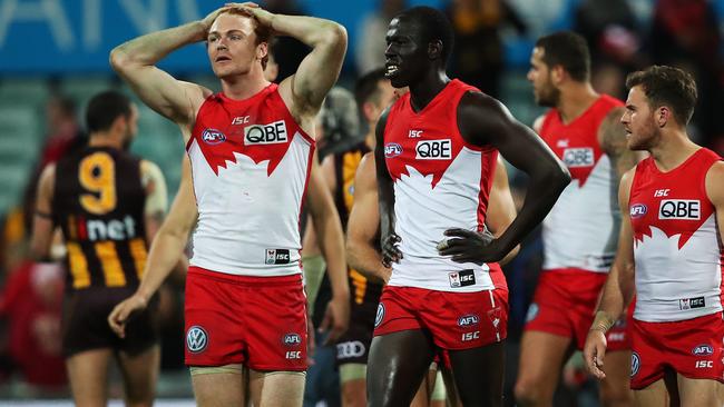 Disappointed Sydney players, including Gary Rohan, after the final siren. Picture: Phil Hillyard