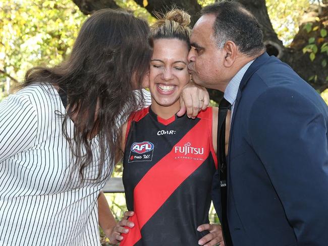 Potential new Essendon AFLW player Michaela Long with mum and dad, Lesley Turner and Essendon legend Michael Long.