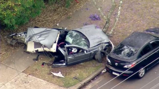 Two men are seen in footage walking from a wreckage at the scene of a fatal car crash on Maxwells Road in Ashcroft where two young boys were killed. Pictures -Nine