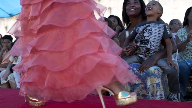 Inmates and their relatives watch female prisoners compete in an annual beauty contest. Picture: AP Photo/Silvia Izquierdo.