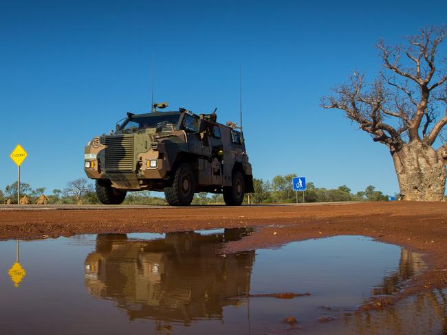 An Australian Army Bushmaster protected mobility vehicle from 1st Brigade drives along the Great Northern Highway during Exercise Northern Shield 2016. The Bushmasters have been treated with a special blast mitigation coating from Gold Coast company Rhino Linings. PHOTO: Department of Defence