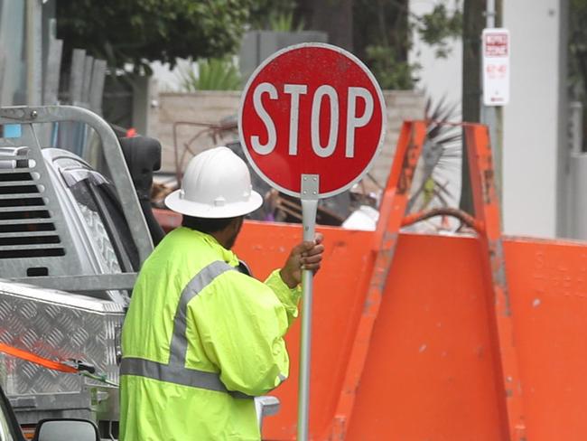 Construction sites on the Gold Coast are taking over more public space than ever before.  Drift in Hughes St closed the footpath and took over one lane of the road, using lollipop men in the street to control traffic.Picture Glenn Hampson