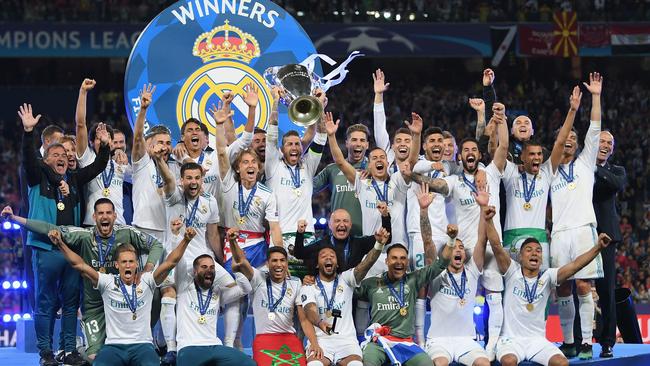 Sergio Ramos lifts the Champions League trophy as Real Madrid victory over Liverpool in the final last May in Kiev. Picture: Getty Images