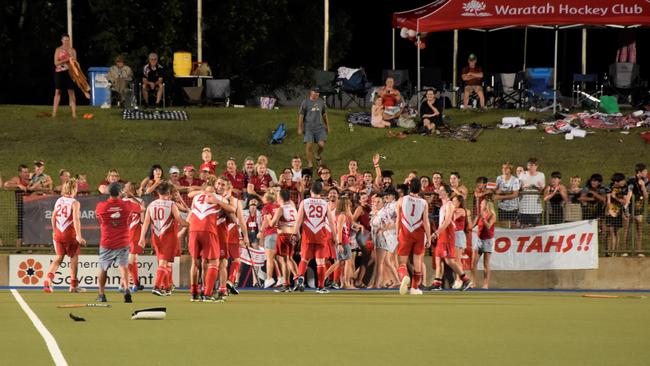 The 'Tahs run to their supporters on the hill after winning the DHL23 A-grade premiership on Saturday.