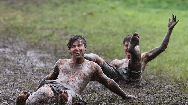 The Queensland Premier is keen to get children back to school as soon as it’s safe. Here, kids are pictured sliding down a muddied Kirra Hill in Coolangatta as Cyclone Alfred caused erosion and rough seas on the Gold Coast. Picture: Adam Head