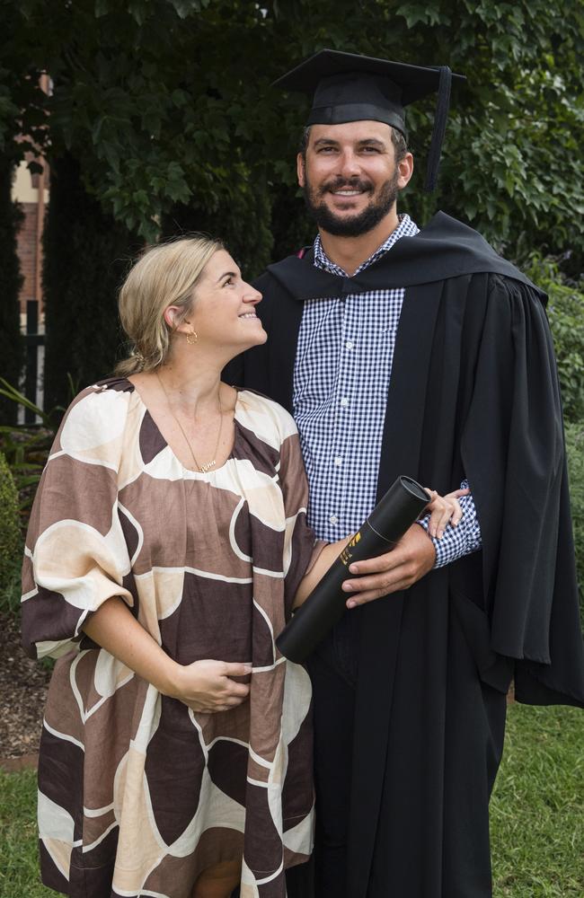 Bachelor of Surveying (Honours) graduate Jake Linnett is congratulated by partner Lena Hewitt at a UniSQ graduation ceremony at Empire Theatres, Wednesday, February 14, 2024. Picture: Kevin Farmer