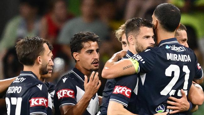 MELBOURNE, AUSTRALIA - MARCH 08: Bruno Fornaroli of Melbourne Victory is congratulated by team mates after scoring a goal during the round 22 A-League Men match between Melbourne Victory and Central Coast Mariners at AAMI Park, on March 08, 2025, in Melbourne, Australia. (Photo by Quinn Rooney/Getty Images)