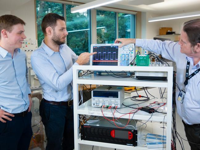 L to R: Mr Peter McNair, Dr Matthew Priestley, Dr Thomas McNeill from UNSW. The team with the oscilloscope in the drone motor drive lab