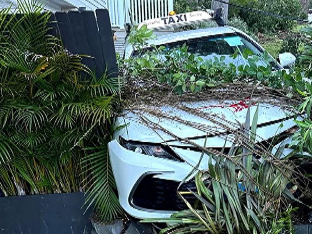 A young taxi driver has lost his licence after alleging crashing into the front yard of a Sydney home. Picture: 9News.