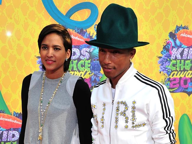 Pharrell Williams and his wife Helen Lasichanh attend the NBA