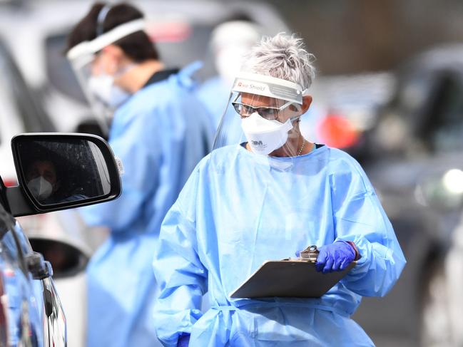 BRISBANE, AUSTRALIA - NewsWire Photos - SEPTEMBER 30, 2021.A health worker processes members of the public at a drive through Covid-19 testing clinic at Murarrie in Brisbane. Picture: NCA NewsWire / Dan Peled