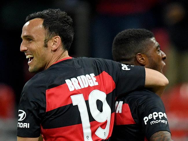 Roly Bonevacia of the Wanderers (right) celebrates with Mark Bridge after scoring a goal during the round 2 A-League match between the Western Sydney Wanderers and the Central Coast Mariners at Spotless Stadium in Sydney, Saturday, October 14, 2017. (AAP Image/Dan Himbrechts) NO ARCHIVING, EDITORIAL USE ONLY