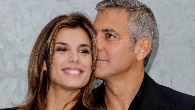 Elisabetta Canalis and George Clooney attend the Giorgio Armani Spring/Summer 2011 fashion show. Picture: Venturelli/WireImage