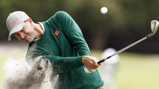 Adam Scott winces as he plays out of bunker at Kingston Heath. Picture: Getty Images.