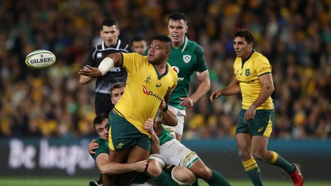 SYDNEY, AUSTRALIA — JUNE 23: Tolu Latu of the Wallabies offloads the ball during the Third International Test match between the Australian Wallabies and Ireland at Allianz Stadium on June 23, 2018 in Sydney, Australia. (Photo by Cameron Spencer/Getty Images)