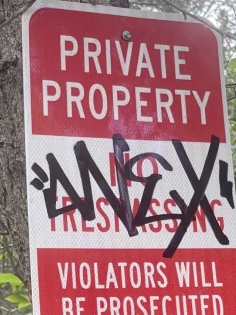 The signs the new homeowner put up were quickly vandalised. Pictures: Tiktok / wickedwitch_ofthe_west