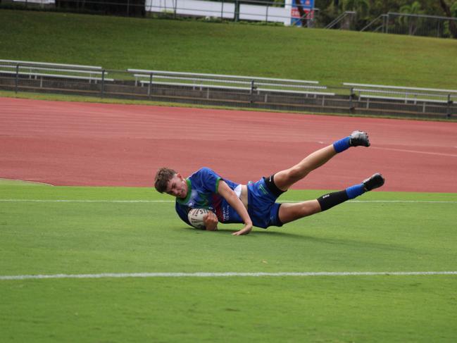 Innisfail Leprechauns’ Oscar Rogers dives in for a try during the Far North Queensland Under 13s grand final at Barlow Park against Edmonton Storm. Picture: Jake Garland