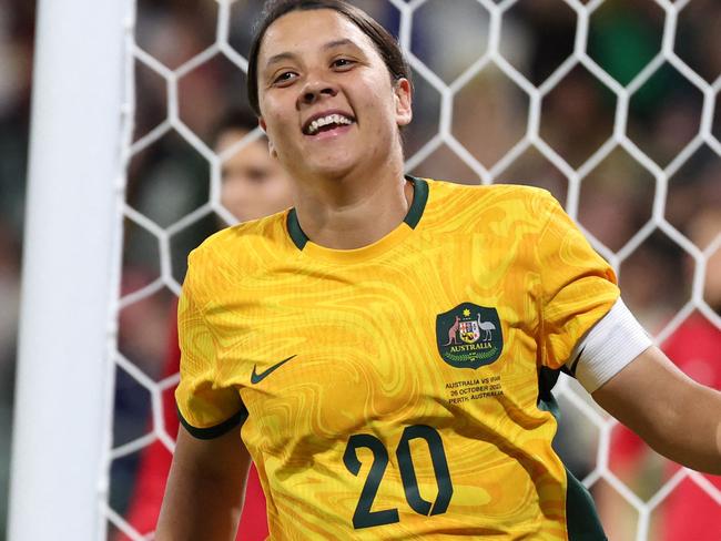 (FILES) Australia's Sam Kerr celebrates her goal during the Asian qualifying round women's football match between Australia and Iran for the Paris 2024 Olympic Games, at the Perth Rectangular  Stadium in Perth on October 26, 2023. Chelsea and Australian women's football star Sam Kerr has been charged with a "racially aggravated offence" following a dispute involving a police officer, London's Met Police said on March 4, 2024. "The charge relates to an incident involving a police officer who was responding to a complaint involving a taxi fare on 30 January 2023 in Twickenham," the statement said. (Photo by COLIN MURTY / AFP) / -- IMAGE RESTRICTED TO EDITORIAL USE - STRICTLY NO COMMERCIAL USE --