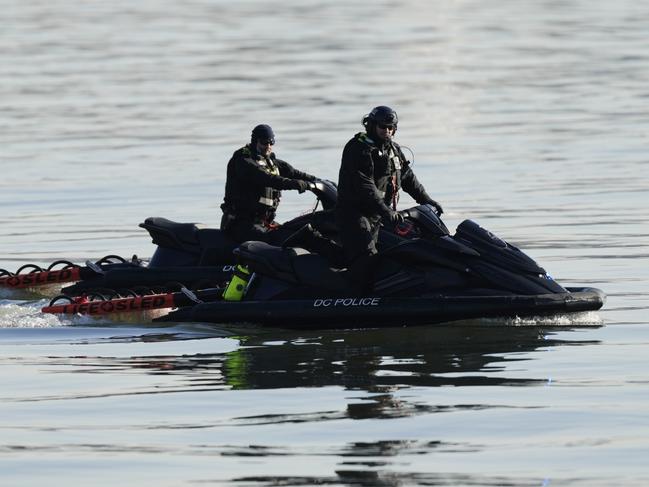 Search and rescue efforts are seen around a wreckage site in the Potomac River from Ronald Reagan Washington National Airport in Arlington, Virginia. Picture: AP