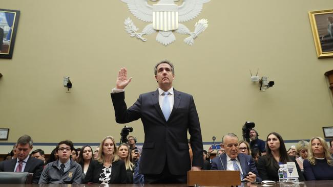 A doleful looking Michael Cohen prepares to testify before the House of Representatives oversight and reform committee on Capitol Hill yesterday. Picture: AP