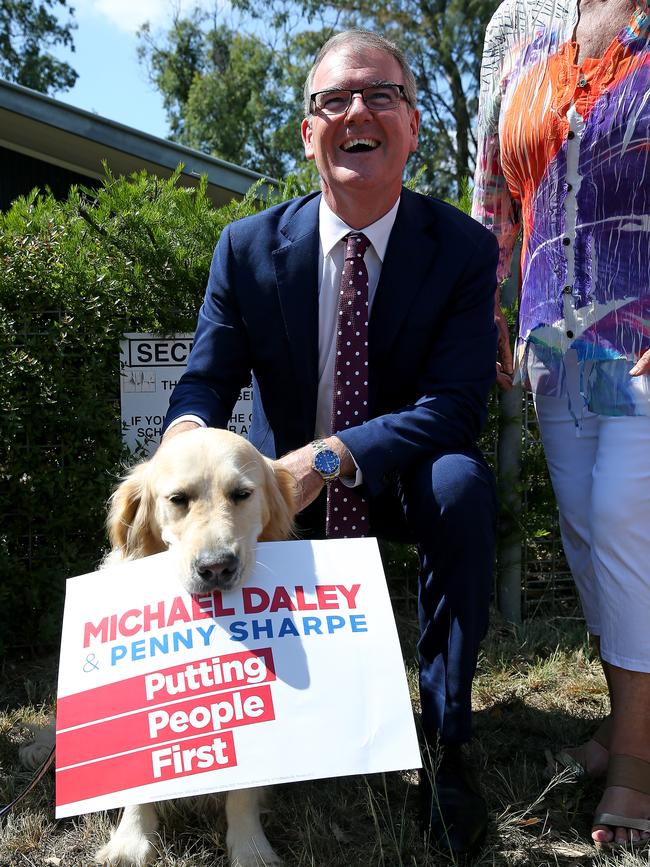 The Opposition Leader was all smiles as Ellie munched on the placard. Picture: Toby Zerna