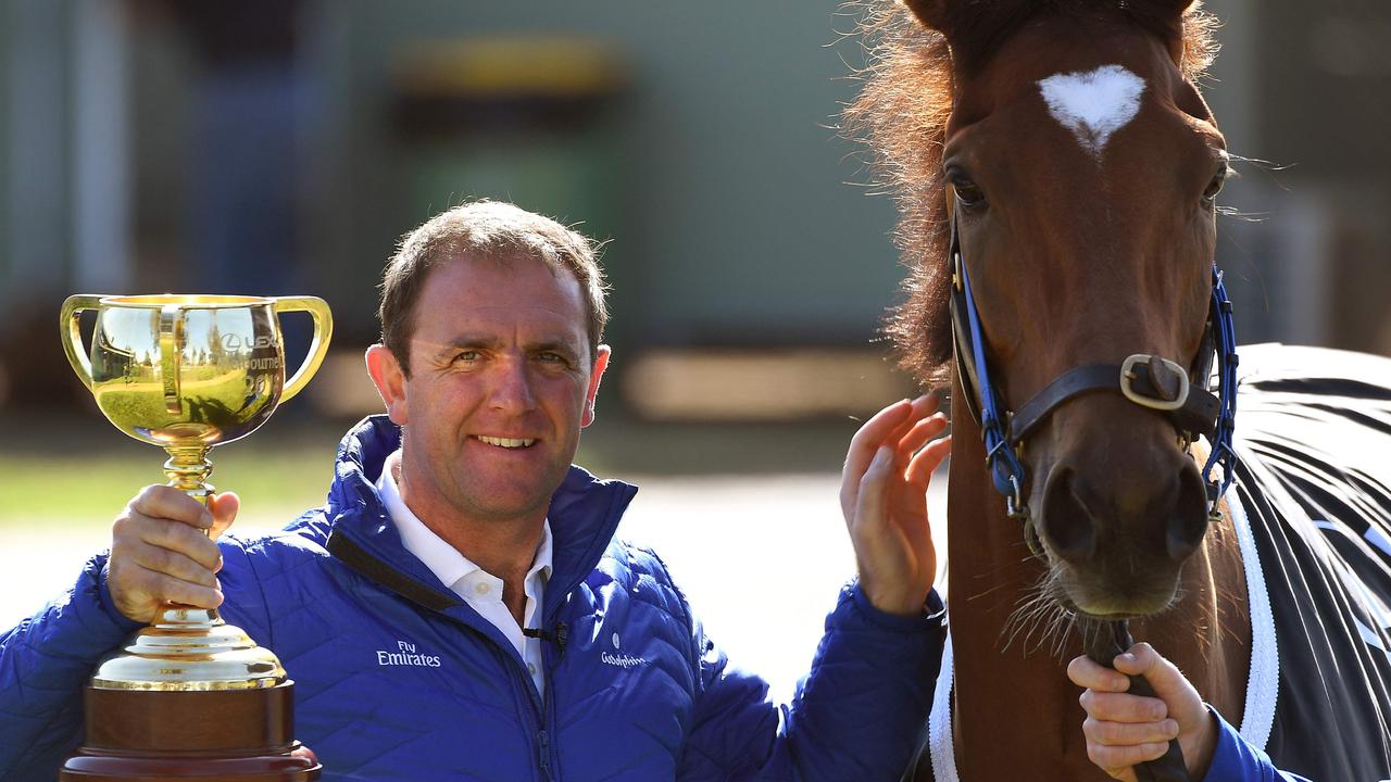 Trainer Charlie Appleby holds the 2018 Melbourne Cup with winning horse Cross Counter. Picture: William West/AFP