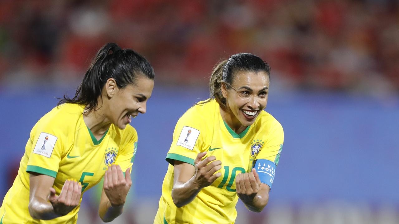 Brazil's Marta (r) is now the all-time leading scorer in World Cup history
