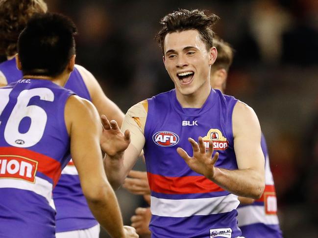 MELBOURNE, AUSTRALIA - AUGUST 21: Toby McLean of the Bulldogs (right) celebrates a goal with Lin Jong of the Bulldogs during the 2016 AFL Round 22 match between the Essendon Bombers and the Western Bulldogs at Etihad Stadium on August 21, 2016 in Melbourne, Australia. (Photo by Adam Trafford/AFL Media/Getty Images)