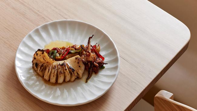 Whole grilled squid, red capsicum at Cottage Kitchen restaurant, North Adelaide. Picture: Supplied