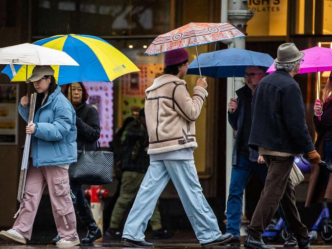 Wet weather photos:  People on the streets in the city of Adelaide with umbrellas to shettler from the rain, on June 29th, 2024.Picture: Tom Huntley