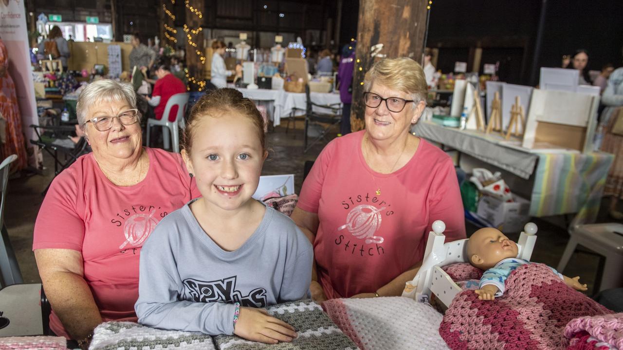 The Sister's Stitch. Sue Glasscock and Cheryl Stevens with Sophia Prentice in front. Mums &amp; Bubs Expo at the Makers Market Toowoomba. Sunday, May 15, 2022. Picture: Nev Madsen.